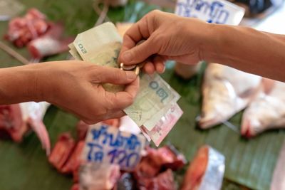 Close-up of hand holding paper