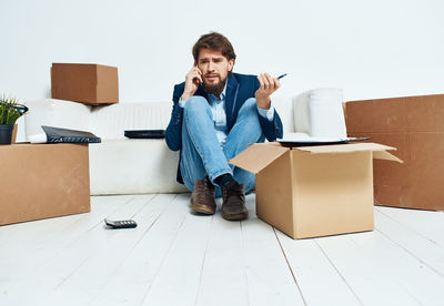 Portrait of young man using mobile phone