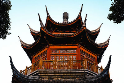 Low angle view of temple against building