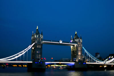 View of suspension bridge at night