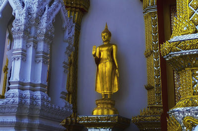 Statue of temple outside building
