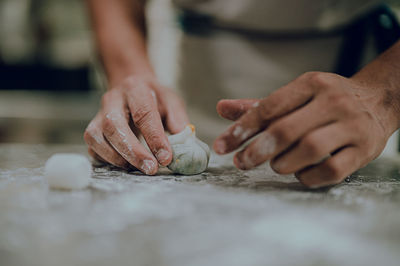 Midsection of man preparing food