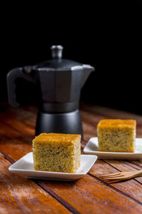 Close-up of chocolate cake on table against black background