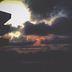 Cloudy sky above city at sunset