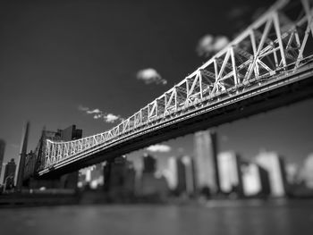 Low angle view of bridge over river against sky