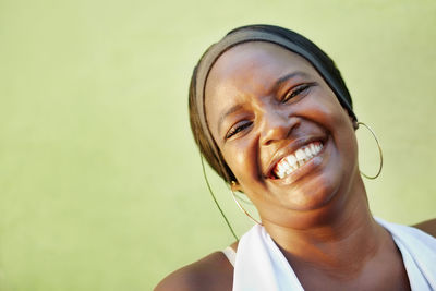 Close-up portrait of smiling young woman