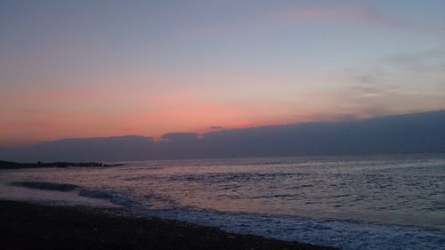 Scenic view of sea against sky at sunset