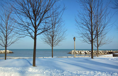 Scenic view of sea against clear sky during winter