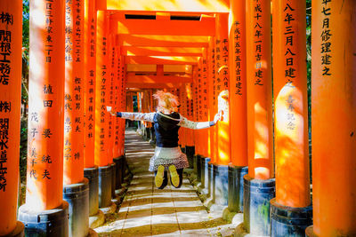 Rear view of man on temple outside building