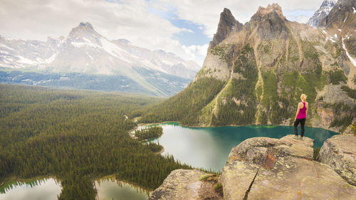 Female hiker looking over opabin plateau in yoho national park