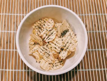 Directly above shot of potato chips in bowl on table