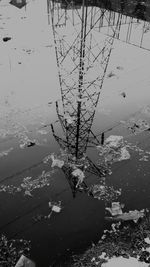 Close-up of water drops on lake against sky