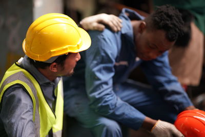 Side view of man working at construction site