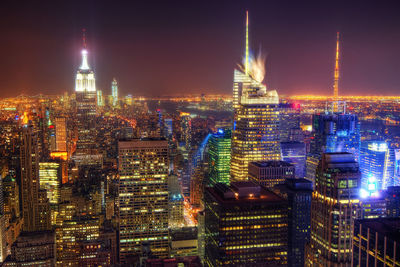 Illuminated buildings in city at night