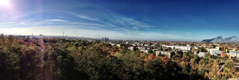 Cityscape against cloudy sky