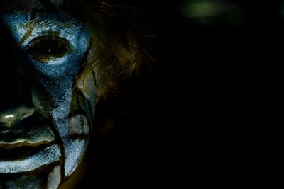 Close-up portrait of man with spooky make-up