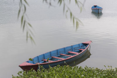 High angle view of boat moored in lake