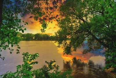 Scenic view of lake against orange sky