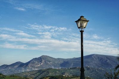 Street light against sky