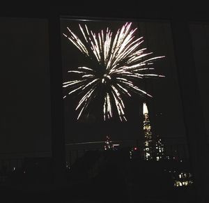 Firework display at night