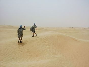 Full length of woman standing on beach