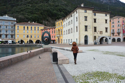 Woman standing in front of buildings