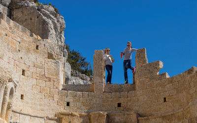 Low angle view of fort against blue sky