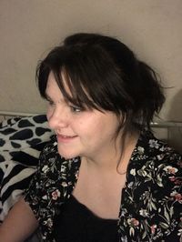 Portrait of young woman looking away at home