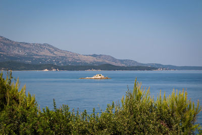 Scenic view of sea against clear sky