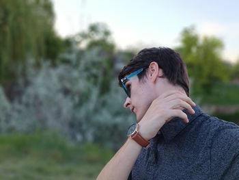 Side view of young man looking away