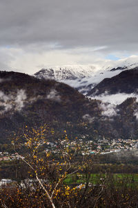 Scenic view of snowcapped mountains against sky