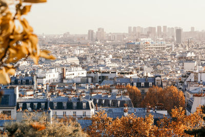 High angle view of buildings in city against sky