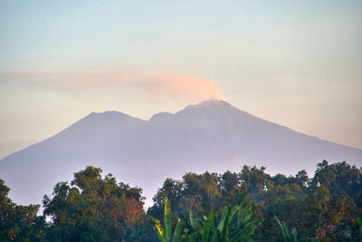 Scenic view of mountains against sky during sunset