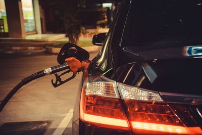 Car refueling at gas station