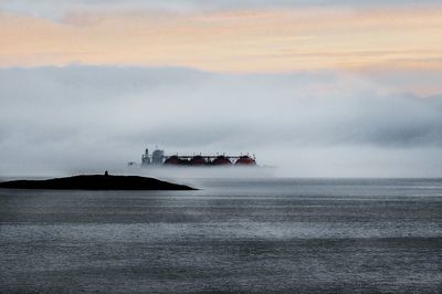 Oil container ship on sea during foggy weather