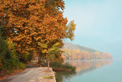 Autumn scene with narrow street around the lake