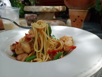 Close-up of noodles served in plate on table