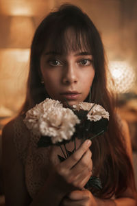 Portrait of a beautiful young woman holding hands