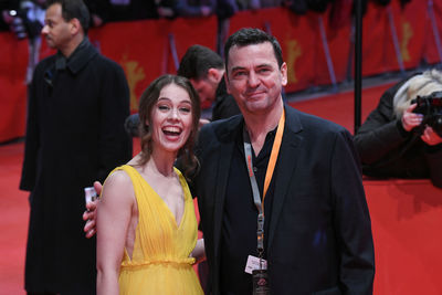 Portrait of young couple standing outdoors