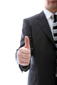 Midsection of man standing against white background