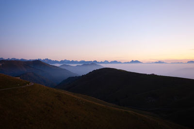 Scenic view of mountains against sky during sunset