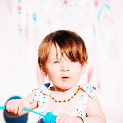 Portrait of cute baby girl with blue eyes