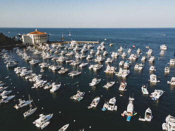 High angle view of sailboats in sea against sky