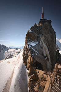 Scenic view of snowcapped mountains against clear sky