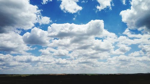 Scenic view of landscape against cloudy sky