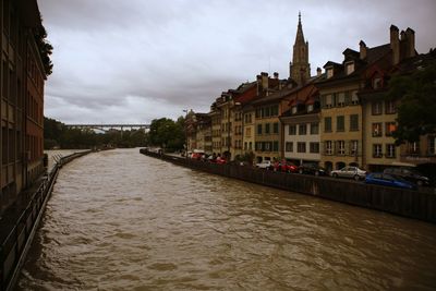 River amidst buildings in city