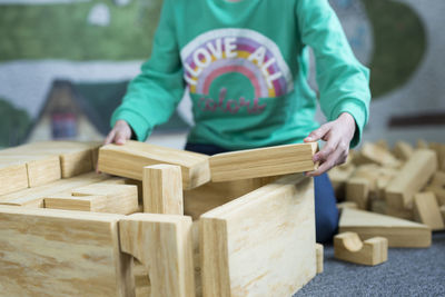Boy playing with wooden bricks