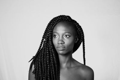 Portrait of a beautiful young woman over white background