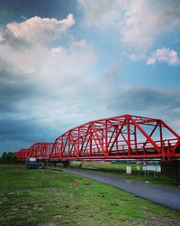 Train on bridge against sky