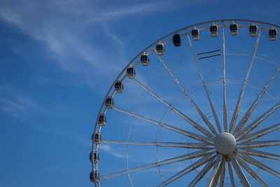 Low angle view of ferris wheel against sky